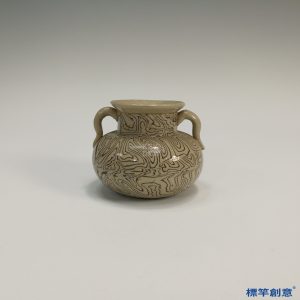 GB042 北宋當陽峪窯土黃釉絞胎回紋雙耳罐